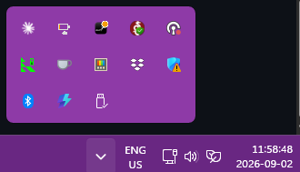 Windows 11 system tray flyout with installed tray icons, including Magic Tray, the app that shows Magic Mouse battery percentage next to the clock
